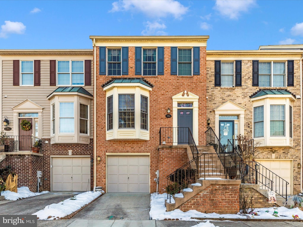 multi unit property featuring a garage