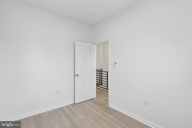 spare room featuring light wood-type flooring