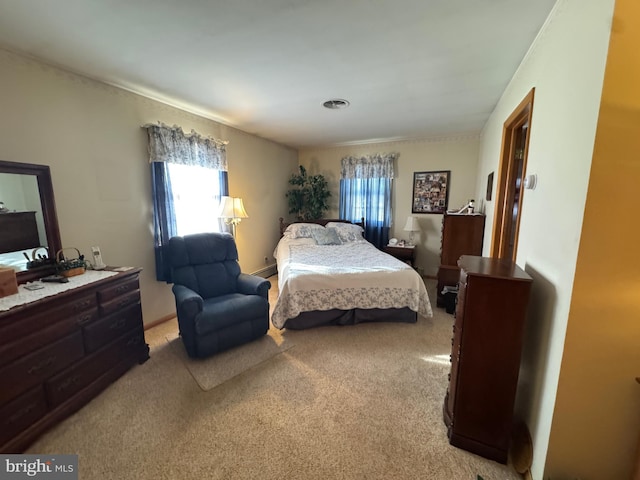 carpeted bedroom featuring a baseboard radiator