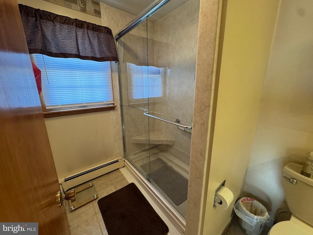 bathroom featuring toilet, an enclosed shower, a baseboard radiator, and tile patterned floors