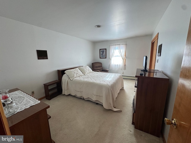 carpeted bedroom featuring a baseboard radiator