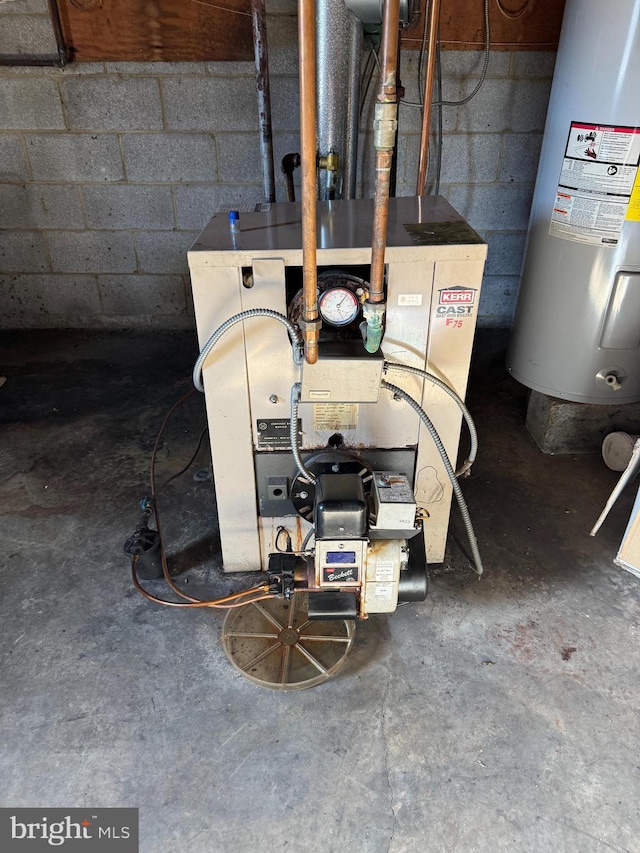 utility room featuring water heater