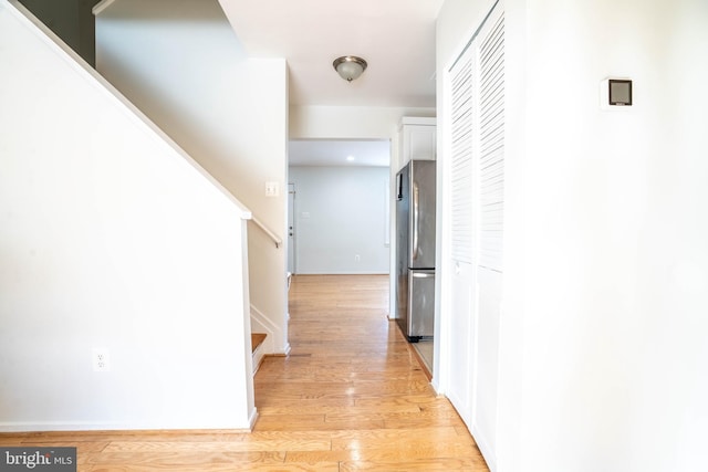 hall with light wood-type flooring