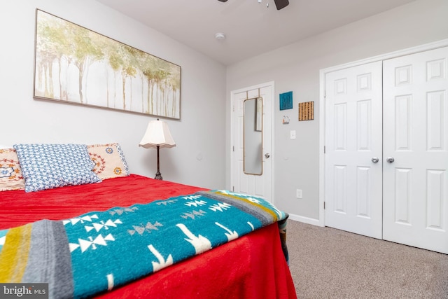 carpeted bedroom with a closet and ceiling fan