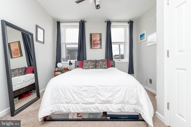 carpeted bedroom with ceiling fan