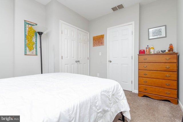 bedroom with carpet floors and a closet