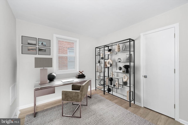 office area with hardwood / wood-style floors