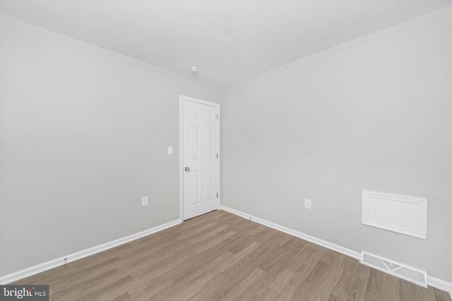 unfurnished room featuring hardwood / wood-style flooring