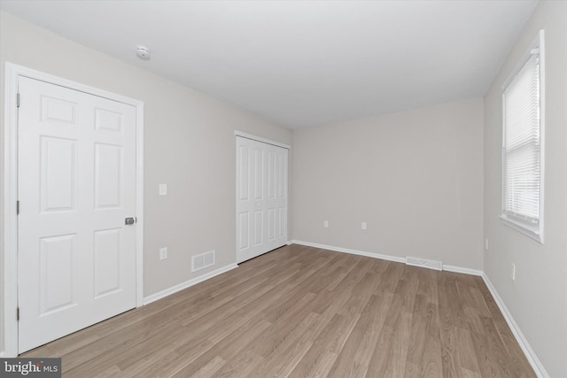 unfurnished bedroom with light hardwood / wood-style flooring