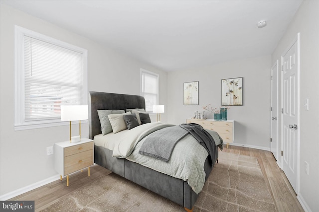 bedroom with light hardwood / wood-style floors