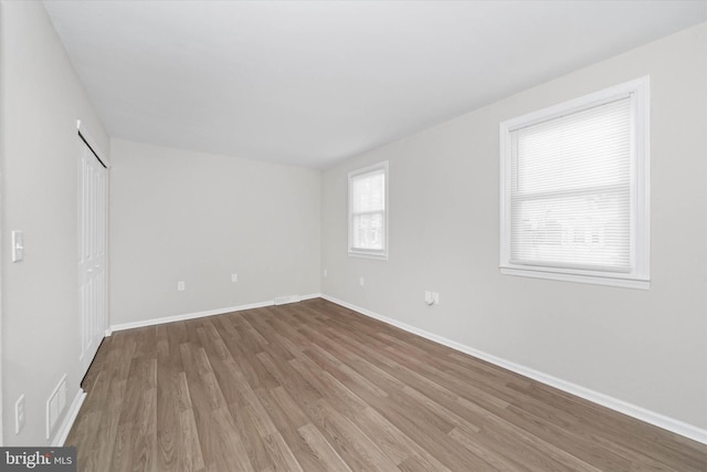 empty room featuring hardwood / wood-style floors
