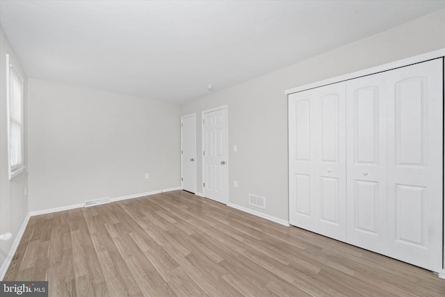unfurnished bedroom with light hardwood / wood-style flooring