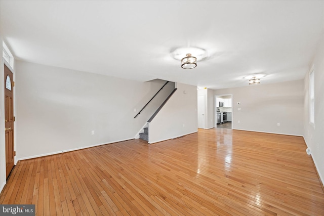 unfurnished living room with light wood-type flooring