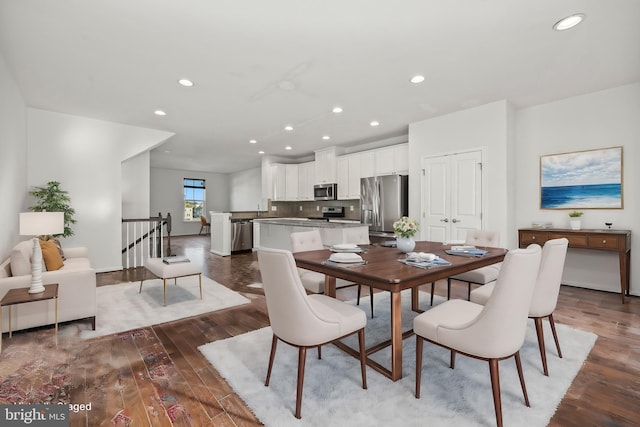 dining space featuring wood-type flooring