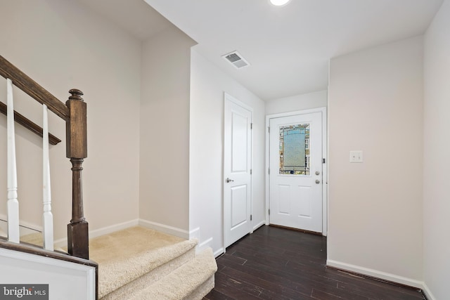 entrance foyer with dark hardwood / wood-style floors