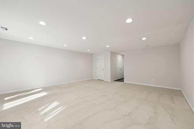 unfurnished room with light carpet