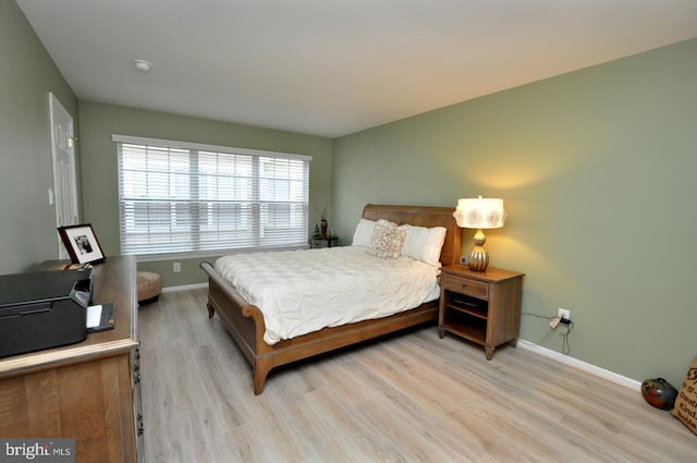 bedroom with light hardwood / wood-style floors