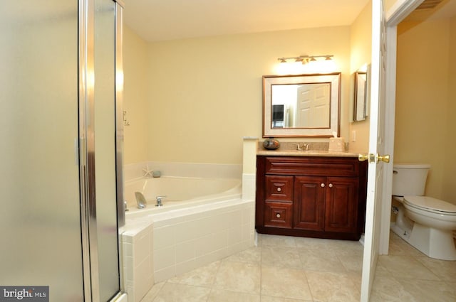 full bathroom featuring toilet, tile patterned floors, separate shower and tub, and vanity