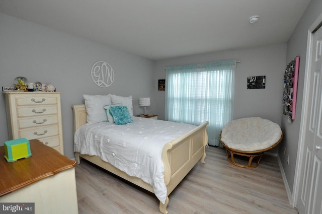 bedroom with light wood-type flooring