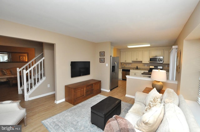 living room with light hardwood / wood-style floors