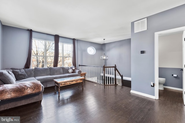 living room featuring dark hardwood / wood-style flooring