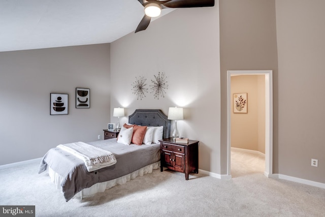 bedroom featuring high vaulted ceiling, ceiling fan, baseboards, and light colored carpet