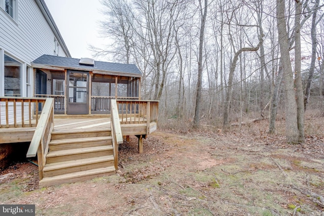 wooden deck featuring a sunroom