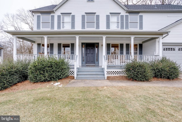 view of front of home featuring a garage, covered porch, roof with shingles, and a front lawn