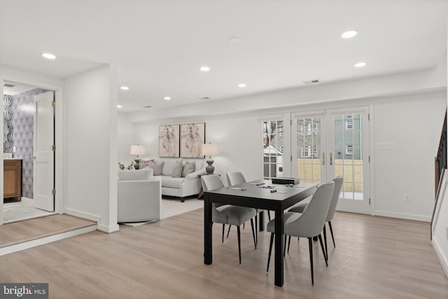 dining area featuring light wood-type flooring