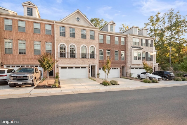 townhome / multi-family property featuring a garage