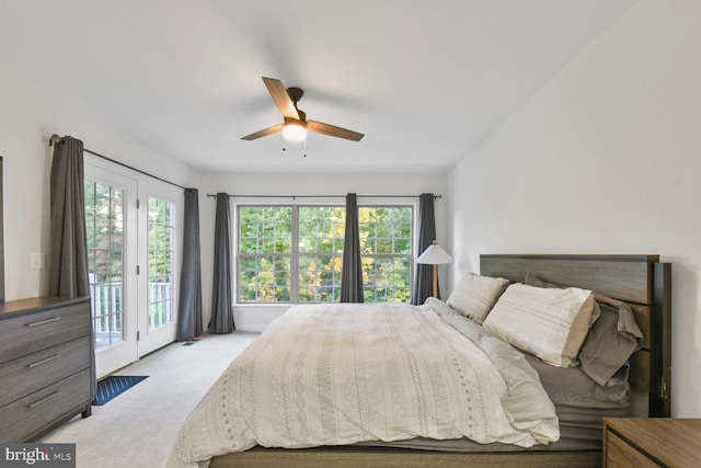 carpeted bedroom with ceiling fan and access to exterior