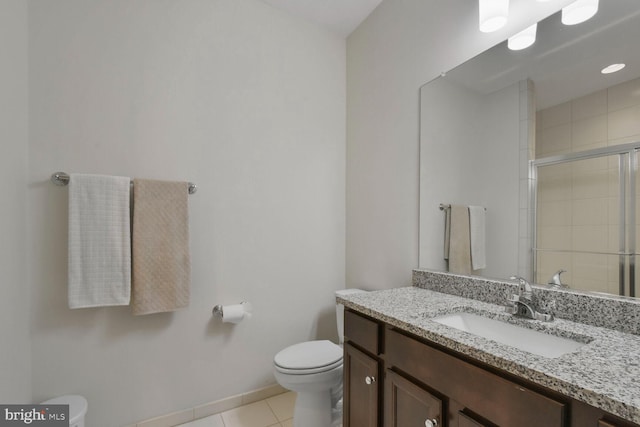 bathroom with toilet, walk in shower, tile patterned floors, and vanity