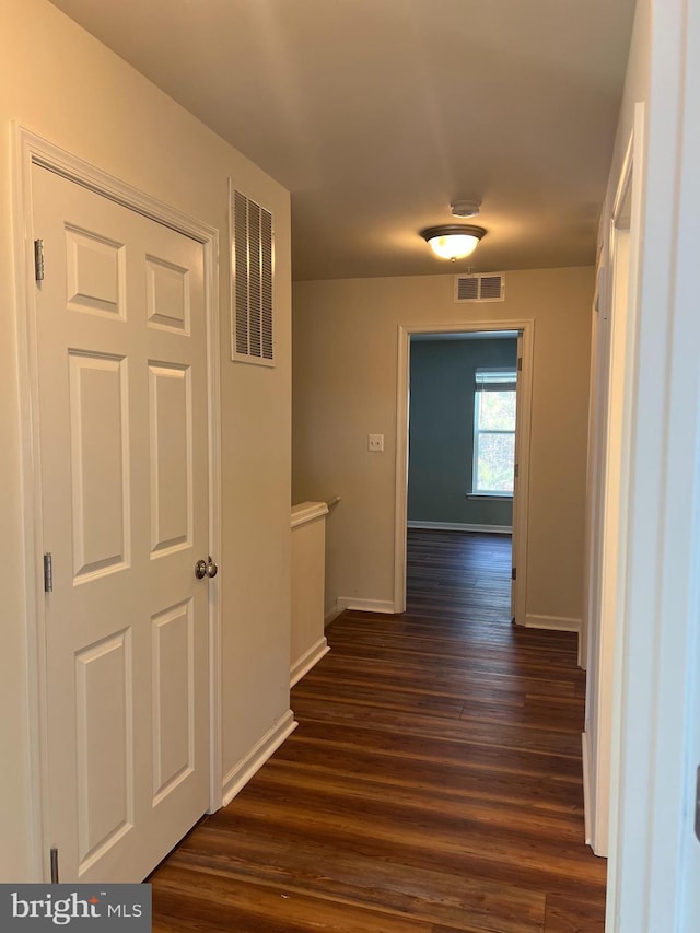 hall with dark hardwood / wood-style floors