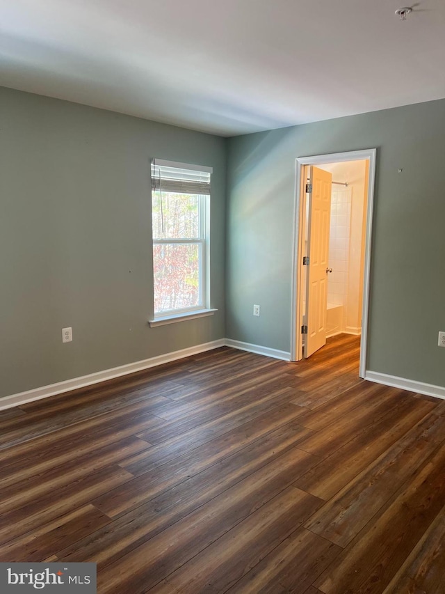 empty room featuring dark hardwood / wood-style floors