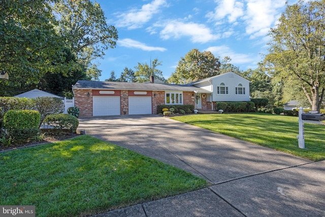 view of front of property with a front lawn and a garage