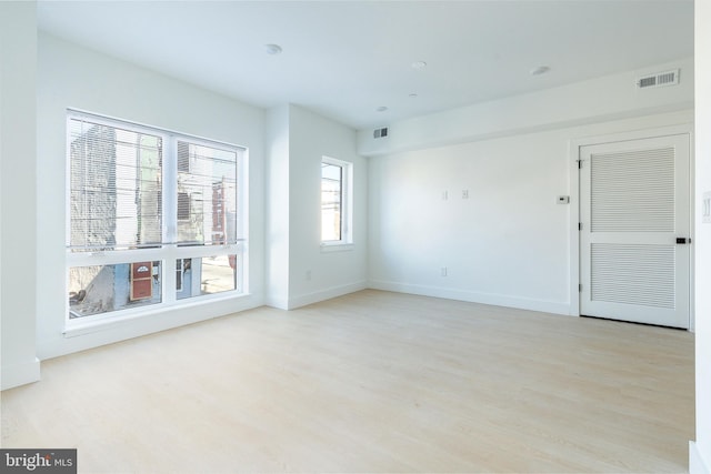 empty room with light wood-type flooring