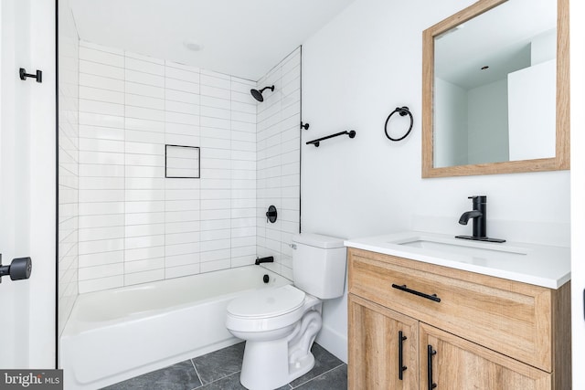 full bathroom featuring toilet, vanity, tile patterned flooring, and tiled shower / bath combo