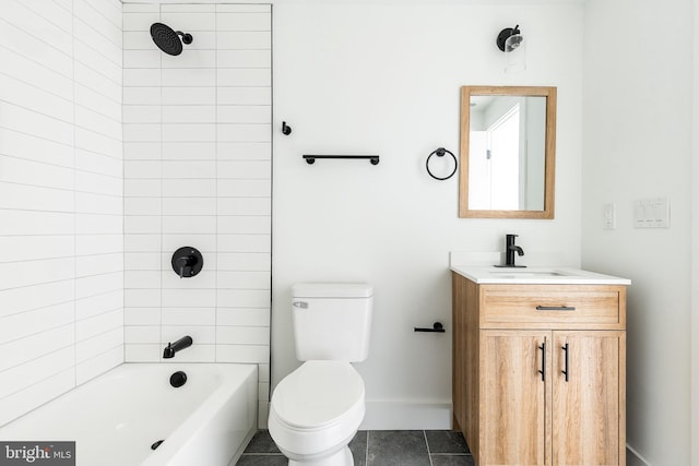 full bathroom featuring tiled shower / bath, tile patterned floors, vanity, and toilet