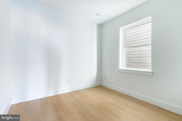 unfurnished room featuring light hardwood / wood-style floors