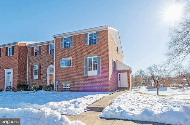 view of front of home with brick siding