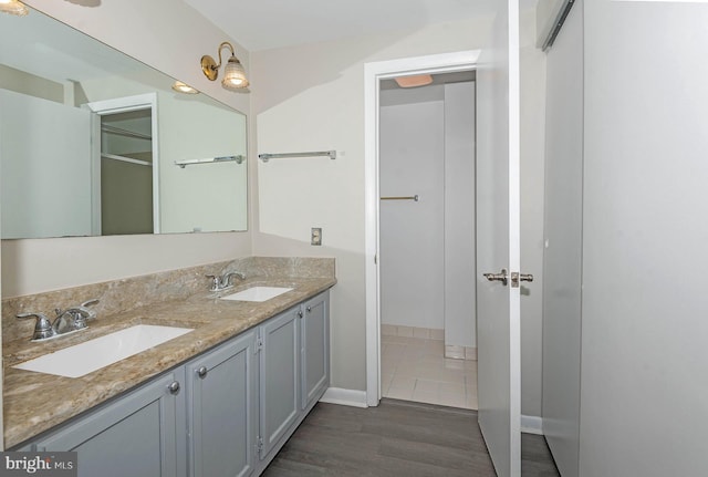 bathroom with vanity and hardwood / wood-style flooring