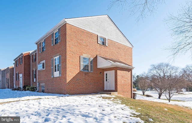 view of snow covered house