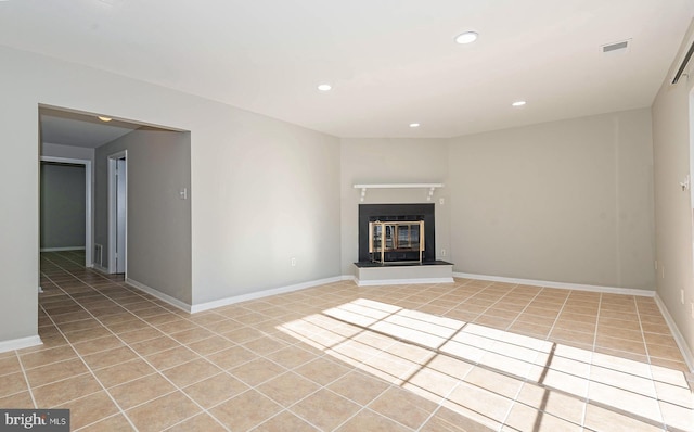 unfurnished living room featuring light tile patterned flooring