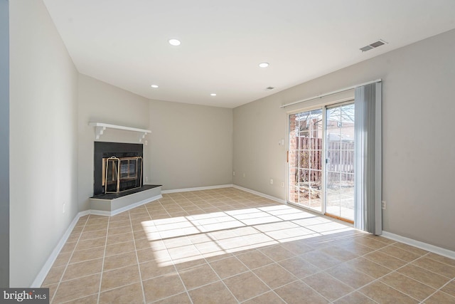 unfurnished living room featuring light tile patterned floors