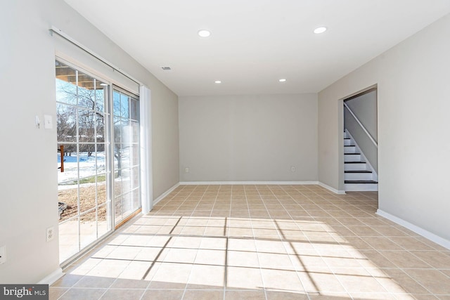 empty room featuring light tile patterned floors