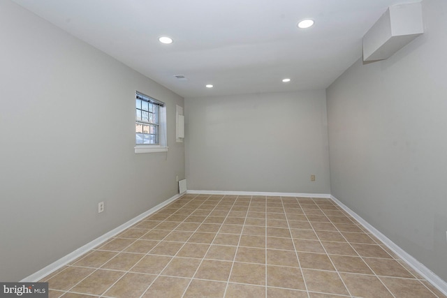 unfurnished room featuring light tile patterned flooring