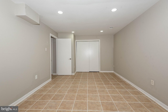 unfurnished bedroom featuring light tile patterned flooring