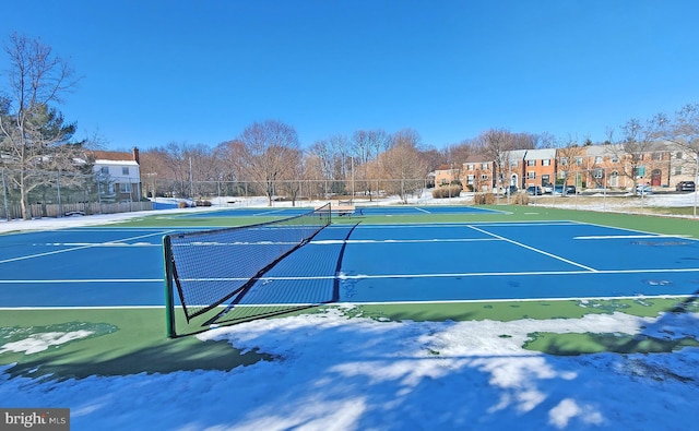 view of tennis court featuring basketball hoop