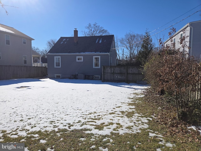 view of snow covered house