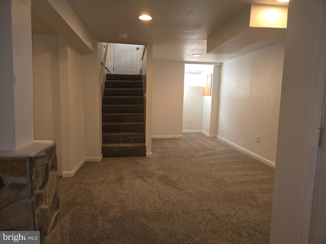 basement with dark colored carpet